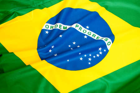 Background - Close up of the silky Brazilian flagの写真素材