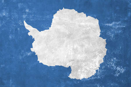 Antarctica - Antarctic Flag on Old Grunge Texture Backgroundの写真素材