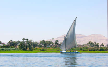 A Boat Sailing on the Nile River in Egypt Luxorの写真素材