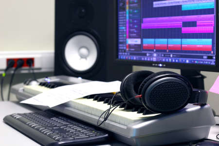Music Production Studio with Keyboard Speaker Headphonesの写真素材