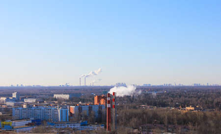 Pipes in city pollution of air with smoke view from a heightの写真素材
