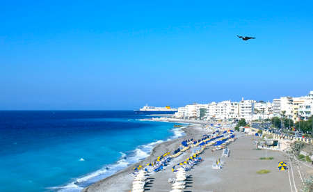 Rhodes City Beach Greece Summer with ship on horizonの写真素材