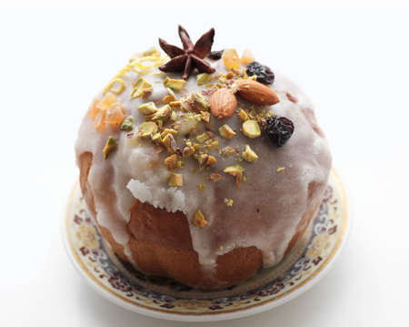 Delicious dessert pie with slices of dried fruit and almonds isolationの写真素材