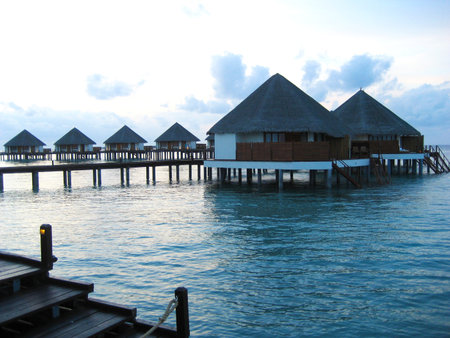 Water Villas or bungalows on a perfect tropical island, in the Maldives island! The photo is perfect for projects with themes of travel, vacation, tourism, relaxation, rest, chillのeditorial素材