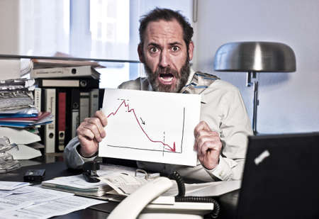 Businessman sees the bankrupcy and gets panic {shot on PhaseOne P45}の写真素材