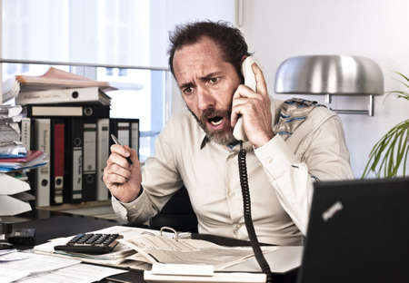 Businessman goes upset while on the phone {shot on PhaseOne P45}の写真素材