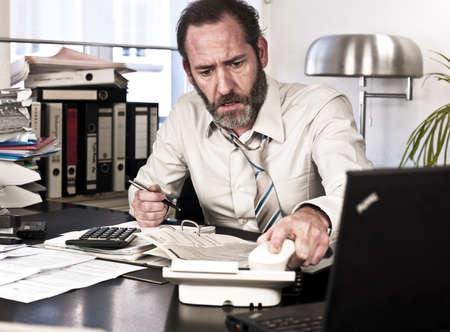 Businessman hangs up the phone - angry {shot on PhaseOne P45}の写真素材