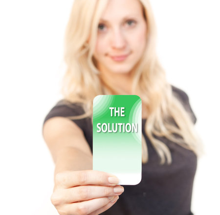 Young woman is smiling while showing a solution Card