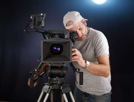 cameraman working with a cinema cameraの写真素材