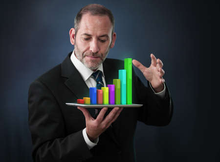 Businessman with Tablet Pc shows an analysis tool graphの写真素材