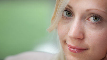 Closeup portrait of happy cheerful young beautiful blond woman