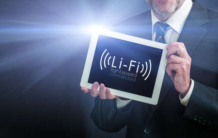 Li-Fi W-Lan technology, internet and networking concept - Young man activates Li-Fi High speed connectionの写真素材