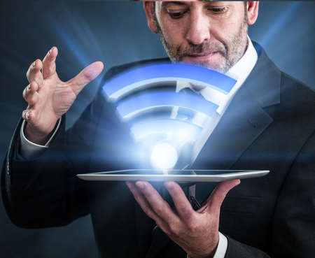 Li-Fi W-Lan technology, internet and networking concept - Businessman activates Li-Fi High speed connectionの写真素材