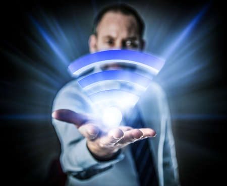 Li-Fi W-Lan technology, internet and networking concept - Businessman activates Li-Fi High speed connectionの写真素材