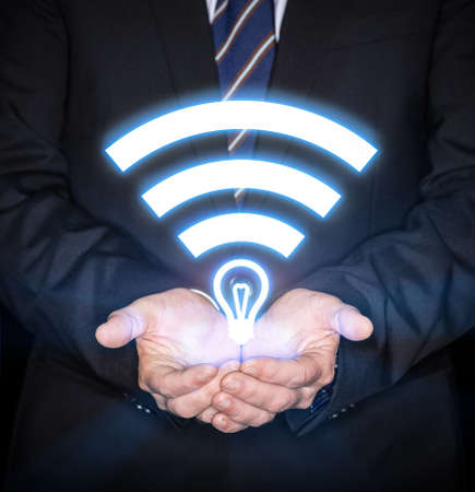 Li-Fi W-Lan technology, internet and networking concept - Young businessman activates Li-Fi High speed connectionの写真素材