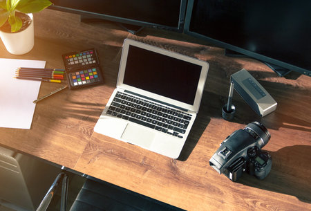 Top view of a modern desktop shot Digital Medium Format Camera with laptop on stylish Photo wooden...
