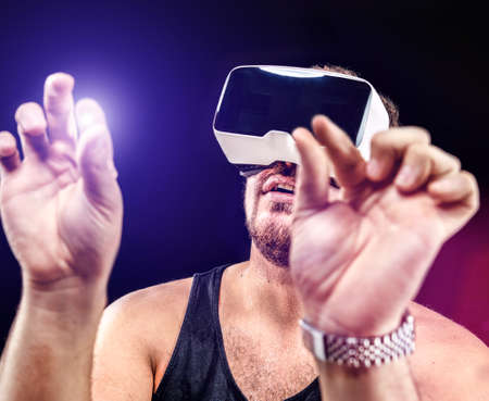 Man has fun using his Virtual Realitiy VR glasses head mounted displayの写真素材