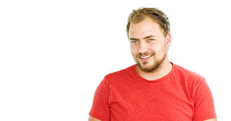 Portrait of handsome bearded young man with beaming smileの写真素材