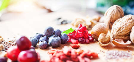 Superfood: variation of superfoods on wooden background