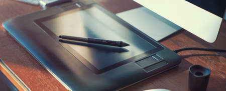 Computer on desktop in hipster workplace officeの写真素材
