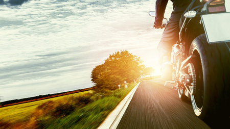 motorbike on the road riding. having fun driving the empty road on a motorcycle tour journey....