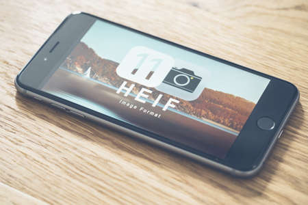 AACHEN, GERMANY - JUNE 22, 2017: HEIF Logo on  Apple iPone 7. HEIF is a new image compression used by apple in iOS 11 to reduce the storage on mobile devices, developed by the Moving Picture Experts Group (MPEG).のeditorial素材
