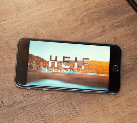 AACHEN, GERMANY - JUNE 22, 2017: HEIF Logo on  Apple iPone 7. HEIF is a new image compression used by apple in iOS 11 to reduce the storage on mobile devices, developed by the Moving Picture Experts Group (MPEG).のeditorial素材
