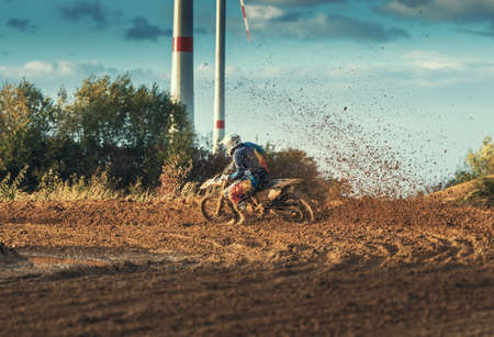 Arnoldsweiler, Germany, October 05,2017: Extreme Motocross MX Rider riding on dirt track on a sunny late summer day on public training session in preparation for motocross event.のeditorial素材