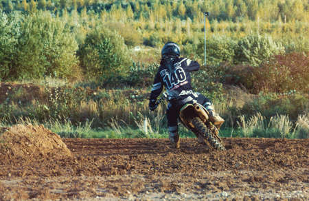 Arnoldsweiler, Germany, October 05,2017: Extreme Motocross MX Rider riding on dirt track on a sunny late summer day on public training session in preparation for motocross event.のeditorial素材