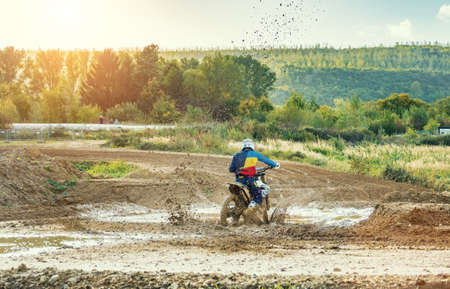 Arnoldsweiler, Germany, October 05,2017: Extreme Motocross MX Rider riding on dirt track on a sunny late summer day on public training session in preparation for motocross event.のeditorial素材