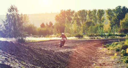 Arnoldsweiler, Germany, October 05,2017: Extreme Motocross MX Rider riding on dirt track on a sunny late summer day on public training session in preparation for motocross event.のeditorial素材