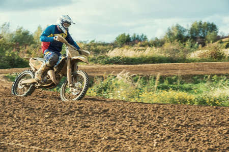 Arnoldsweiler, Germany, October 05,2017: Extreme Motocross MX Rider riding on dirt track on a sunny late summer day on public training session in preparation for motocross event.のeditorial素材
