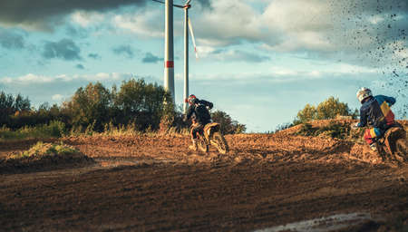 Arnoldsweiler, Germany, October 05,2017: Extreme Motocross MX Rider riding on dirt track on a sunny late summer day on public training session in preparation for motocross event.のeditorial素材