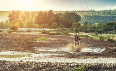 Arnoldsweiler, Germany, October 05,2017: Extreme Motocross MX Rider riding on dirt track on a sunny late summer day on public training session in preparation for motocross event.のeditorial素材