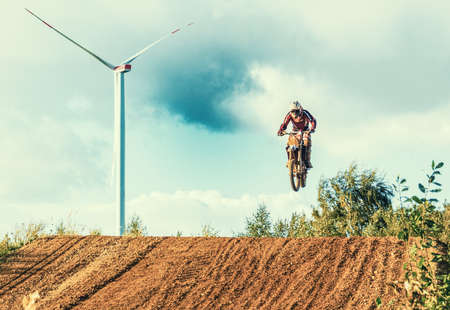 Arnoldsweiler, Germany, October 05,2017: Extreme Motocross MX Rider riding on dirt track on a sunny late summer day on public training session in preparation for motocross event.のeditorial素材