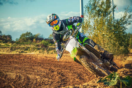 Arnoldsweiler, Germany, October 05,2017: Extreme Motocross MX Rider riding on dirt track on a sunny late summer day on public training session in preparation for motocross event.のeditorial素材