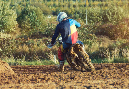 Arnoldsweiler, Germany, October 05,2017: Extreme Motocross MX Rider riding on dirt track on a sunny late summer day on public training session in preparation for motocross event.のeditorial素材