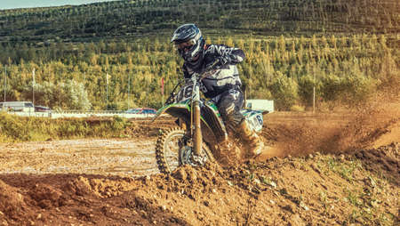 Arnoldsweiler, Germany, October 05,2017: Extreme Motocross MX Rider riding on dirt track on a sunny late summer day on public training session in preparation for motocross event.のeditorial素材