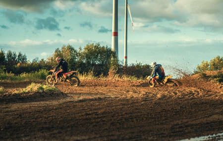 Arnoldsweiler, Germany, October 05,2017: Extreme Motocross MX Rider riding on dirt track on a sunny late summer day on public training session in preparation for motocross event.のeditorial素材