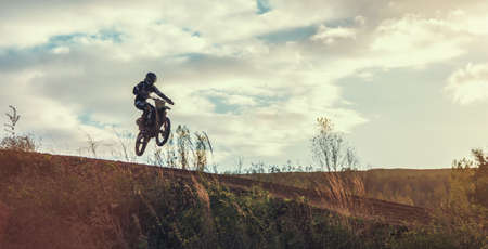 Arnoldsweiler, Germany, October 05,2017: Extreme Motocross MX Rider riding on dirt track on a sunny late summer day on public training session in preparation for motocross event.のeditorial素材