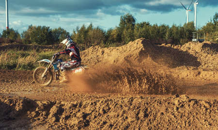 Arnoldsweiler, Germany, October 05,2017: Extreme Motocross MX Rider riding on dirt track on a sunny late summer day on public training session in preparation for motocross event.のeditorial素材