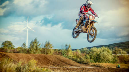 Arnoldsweiler, Germany, October 05,2017: Extreme Motocross MX Rider riding on dirt track on a sunny late summer day on public training session in preparation for motocross event.のeditorial素材