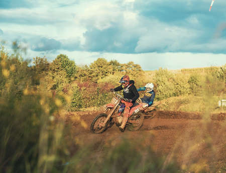 Arnoldsweiler, Germany, October 05,2017: Extreme Motocross MX Rider riding on dirt track on a sunny late summer day on public training session in preparation for motocross event.のeditorial素材