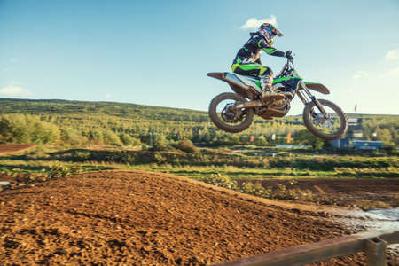 Arnoldsweiler, Germany, October 05,2017: Extreme Motocross MX Rider riding on dirt track on a sunny late summer day on public training session in preparation for motocross event.のeditorial素材