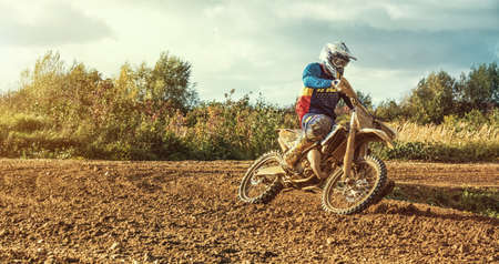 Arnoldsweiler, Germany, October 05,2017: Extreme Motocross MX Rider riding on dirt track on a sunny late summer day on public training session in preparation for motocross event.のeditorial素材