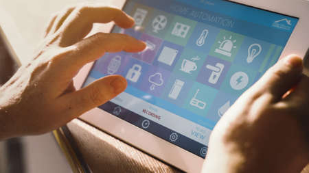 smart house device smartphone with app icons on tablet pcの写真素材