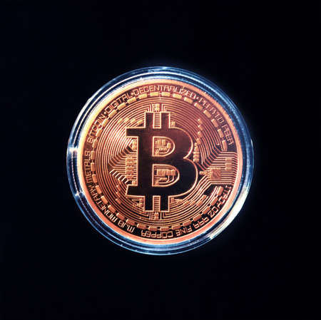 bitcoins - bit coin BTC the new virtual money on dark backgroundの写真素材