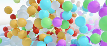 colorful bouncing balls outdoors against blue sunny skyの写真素材