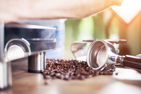 Espresso pouring from classic coffee machine into small white cup. Close-up Shot.の写真素材