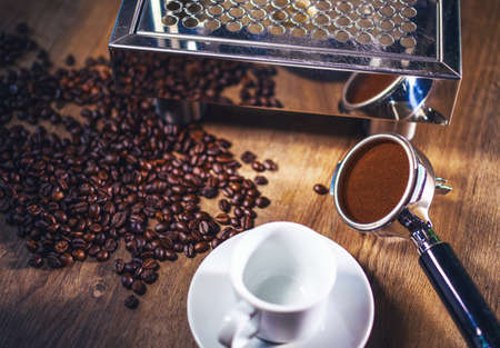 Espresso pouring from classic coffee machine into small white cup. Close-up Shot.の写真素材